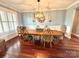 Formal dining room boasts hardwood floors, updated lighting and wainscoting at 141 Weathers Creek Rd, Troutman, NC 28166