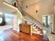 Spacious foyer features hardwood floors, staircase, console table, and an open layout at 141 Weathers Creek Rd, Troutman, NC 28166