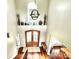 Bright foyer boasts hardwood floors, a staircase, and an ornate wood door at 141 Weathers Creek Rd, Troutman, NC 28166