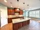 Spacious kitchen features custom cabinets, granite countertops, and stainless appliances at 141 Weathers Creek Rd, Troutman, NC 28166