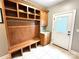 Mudroom with custom built-ins including bench seating, storage and hanging hooks at 141 Weathers Creek Rd, Troutman, NC 28166