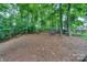 Discover a naturally serene backyard featuring mature trees and native ground cover for a peaceful retreat at 14831 Charterhouse Ln, Huntersville, NC 28078