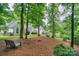 Discover a backyard retreat with tall trees that combine to create a shaded canopy and private retreat at 14831 Charterhouse Ln, Huntersville, NC 28078
