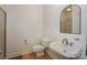 Bathroom with white sink and toilet with hardwood floors at 14831 Charterhouse Ln, Huntersville, NC 28078