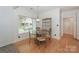 Charming breakfast nook with a glass table and ornate chairs bathed in natural light at 14831 Charterhouse Ln, Huntersville, NC 28078