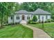 Charming single-story home with landscaped front yard and welcoming entrance at 14831 Charterhouse Ln, Huntersville, NC 28078