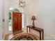 Inviting foyer features hardwood floors, elegant lighting, and a stylish entry table at 14831 Charterhouse Ln, Huntersville, NC 28078