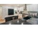 Well-lit kitchen with black countertops, stainless steel appliances, and eat-in island at 14831 Charterhouse Ln, Huntersville, NC 28078