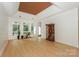 Spacious living room features hardwood floors, neutral walls, and ample natural light at 14831 Charterhouse Ln, Huntersville, NC 28078