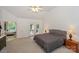 Cozy main bedroom with a large bed, neutral colors, and access to a balcony at 14831 Charterhouse Ln, Huntersville, NC 28078