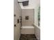 This tiled shower features a built-in bench, a shower head, and a shower handle with a glass enclosure at 14831 Charterhouse Ln, Huntersville, NC 28078
