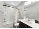 Bathroom featuring a shower-tub and vanity at 15416 Oleander Dr, Charlotte, NC 28278