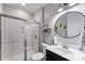 Bathroom featuring a glass door shower and vanity with decor at 15416 Oleander Dr, Charlotte, NC 28278