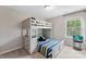 Bedroom with bunkbeds, a TV, and natural light coming through the window at 15416 Oleander Dr, Charlotte, NC 28278