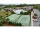 Aerial view showcasing community amenities, including a swimming pool, clubhouse, tennis court, and basketball court at 15416 Oleander Dr, Charlotte, NC 28278