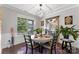 Bright dining room featuring modern light fixture and large window offering plenty of natural light at 15416 Oleander Dr, Charlotte, NC 28278