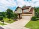 Charming two-story home featuring a manicured lawn and a spacious two-car garage at 15416 Oleander Dr, Charlotte, NC 28278