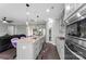 Open kitchen layout featuring stainless steel appliances, granite countertops, and a stylish island at 15416 Oleander Dr, Charlotte, NC 28278