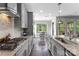 Bright kitchen featuring granite countertops, stainless appliances, and eat-in dining area at 15416 Oleander Dr, Charlotte, NC 28278
