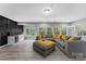 Spacious living room features a cozy seating area, an accent wall, and large windows for lots of natural light at 15416 Oleander Dr, Charlotte, NC 28278