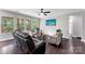 Cozy living room features a comfortable sofa, patterned chairs, and scenic views at 15416 Oleander Dr, Charlotte, NC 28278