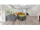 A fully staged living room area with new hardwood floors and great natural light at 15416 Oleander Dr, Charlotte, NC 28278