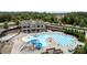 Aerial view of community pool area with water slide, lap lanes, seating, and clubhouse at 15416 Oleander Dr, Charlotte, NC 28278
