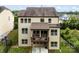 Two-story home's rear exterior featuring a covered deck, neutral siding, and manicured yard is perfect for outdoor living at 15416 Oleander Dr, Charlotte, NC 28278