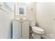 Clean bathroom with white vanity, toilet, and modern fixtures at 1631 Vancouver Dr, Charlotte, NC 28213