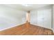 Spacious bedroom with hardwood floors and closet space, perfect for relaxation and storage at 1631 Vancouver Dr, Charlotte, NC 28213