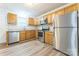 Bright kitchen featuring stainless steel appliances, granite countertops, and modern vinyl plank flooring at 1631 Vancouver Dr, Charlotte, NC 28213