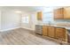 Open kitchen area with stainless steel dishwasher, granite counters, and vinyl flooring at 1631 Vancouver Dr, Charlotte, NC 28213