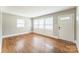 Bright living room with hardwood floors, natural light, and neutral paint at 1631 Vancouver Dr, Charlotte, NC 28213