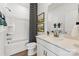 Well-lit bathroom with a combination tub and shower, white vanity with stone countertop, and stylish fixtures at 1940 Westerhill Dr, Fort Mill, SC 29708