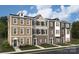 Charming new construction townhome featuring brick and siding exterior and well-manicured front yard at 1940 Westerhill Dr, Fort Mill, SC 29708