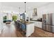 Open-concept kitchen featuring a large center island with seating and modern stainless steel appliances at 1940 Westerhill Dr, Fort Mill, SC 29708