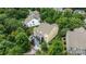 Aerial view of a home surrounded by mature trees and a well-manicured backyard at 2009 Waterbury Ln, Waxhaw, NC 28173