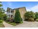Exterior view of a charming two-story home with a manicured front yard and mature trees at 2009 Waterbury Ln, Waxhaw, NC 28173