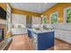 Eat-in kitchen with stainless steel appliances, a marble island with seating, and pendant lighting at 2009 Waterbury Ln, Waxhaw, NC 28173