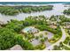 Aerial view of lakefront community featuring a swimming pool, clubhouse, and parking at 2010 Brightflower Ln, York, SC 29745