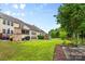 Large backyard with patio, wooden deck, outdoor fireplace, play set, and garden at 2010 Brightflower Ln, York, SC 29745