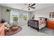 Sun-lit bedroom offers two windows, a ceiling fan and colorful decor at 2010 Brightflower Ln, York, SC 29745