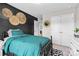 Charming bedroom with decorative wall art, black accent wall, and black and white geometric rug at 2010 Brightflower Ln, York, SC 29745