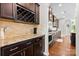 Well-equipped kitchen with dark wood cabinets, granite countertops, and stainless steel appliances at 2010 Brightflower Ln, York, SC 29745
