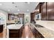 Modern kitchen with stainless steel appliances, granite countertops, and dark wood cabinetry at 2010 Brightflower Ln, York, SC 29745