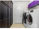Spacious laundry room features a front-load washer and dryer, along with generous cabinet space at 2010 Brightflower Ln, York, SC 29745