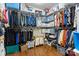 Spacious walk-in closet with ample shelving, hanging rods, and hardwood floors provides storage at 2010 Brightflower Ln, York, SC 29745