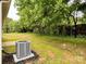 The home features a large backyard, an AC unit and some grass at 212 Queens Ct, Gastonia, NC 28052