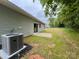 Backyard features an AC unit and a concrete patio at 212 Queens Ct, Gastonia, NC 28052