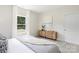 Relaxing bedroom features natural light and lovely furniture at 212 Queens Ct, Gastonia, NC 28052